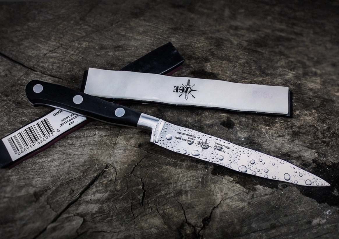 Forge hammer resting on a layered Damascus billet